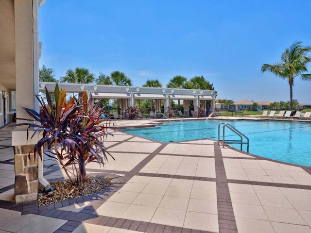 17155 SW Ambrose Way, Port Saint Lucie, FL 34986 - community pool with a patio area