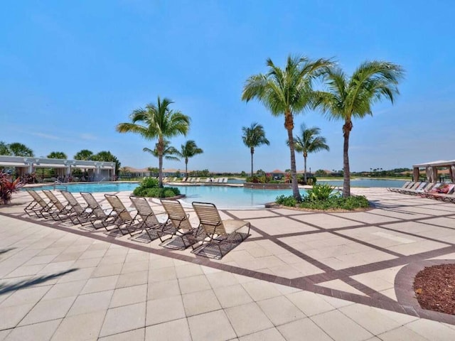 17155 SW Ambrose Way, Port Saint Lucie, FL 34986 - community pool featuring a patio