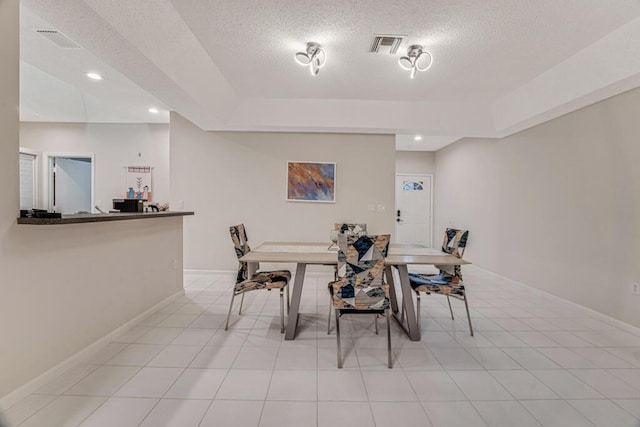 9998 Seacrest Cir Unit C, Boynton Beach, FL 33437 - dining area featuring a textured ceiling, a raised ceiling, baseboards, and recessed lighting