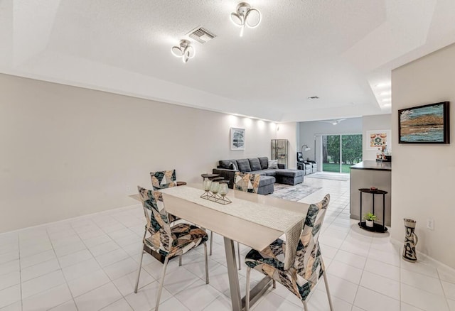 9998 Seacrest Cir Unit C, Boynton Beach, FL 33437 - dining room with light tile patterned floors and a textured ceiling