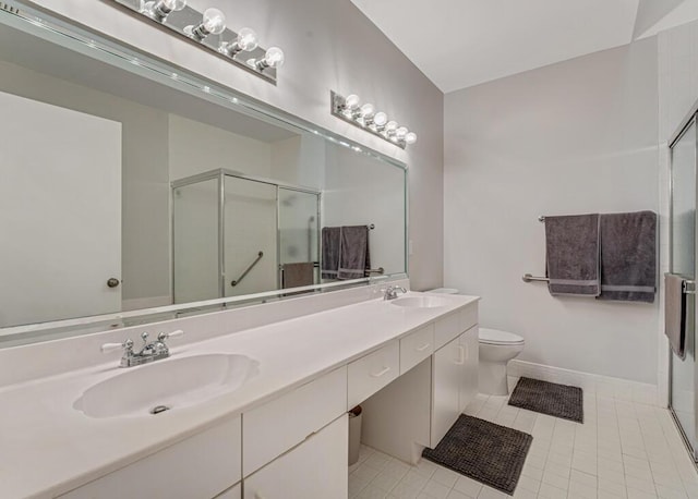 9998 Seacrest Cir Unit C, Boynton Beach, FL 33437 - bathroom with a stall shower, double vanity, tile patterned floors, and toilet