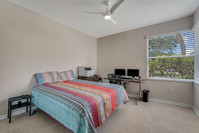 9998 Seacrest Cir Unit C, Boynton Beach, FL 33437 - bedroom featuring tile patterned floors, a textured ceiling, baseboards, and ceiling fan