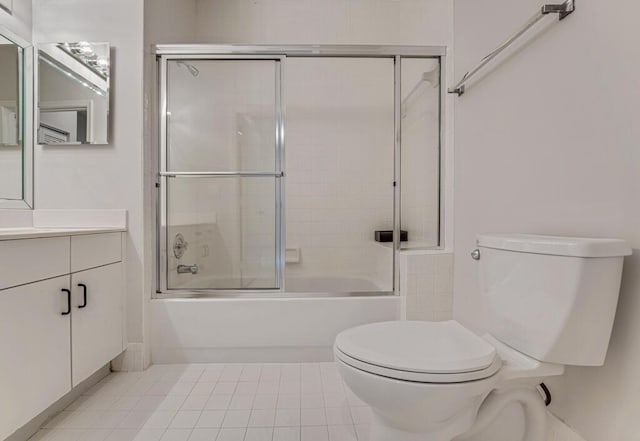 9998 Seacrest Cir Unit C, Boynton Beach, FL 33437 - full bath featuring toilet, vanity, bath / shower combo with glass door, and tile patterned floors