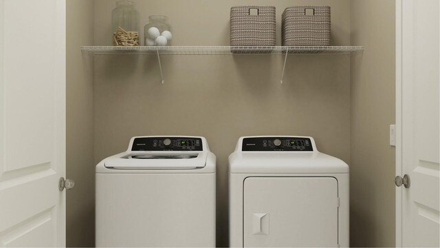 10436 NW Suncrest Loop, Port Saint Lucie, FL 34984 - washroom featuring washing machine and dryer