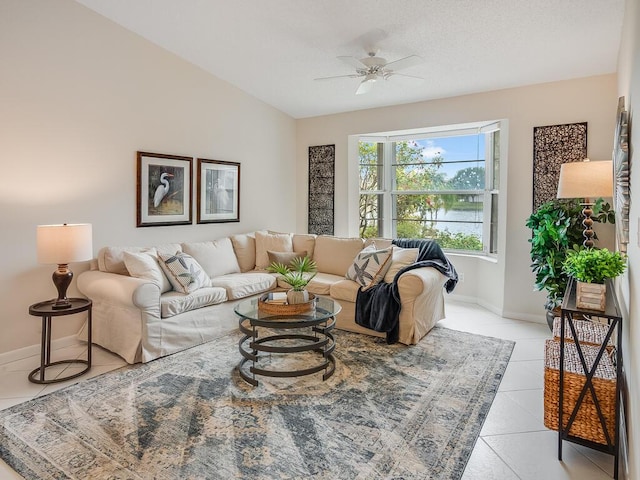 8520 Lake Cypress Rd, Lake Worth, FL 33467 - living room with ceiling fan, light tile patterned floors, and baseboards