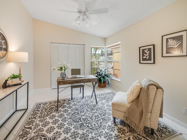 8520 Lake Cypress Rd, Lake Worth, FL 33467 - office space with a ceiling fan, vaulted ceiling, light tile patterned flooring, a textured ceiling, and baseboards