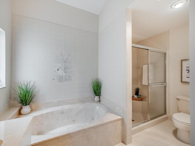8520 Lake Cypress Rd, Lake Worth, FL 33467 - bathroom with toilet, a stall shower, a jetted tub, and tile patterned flooring