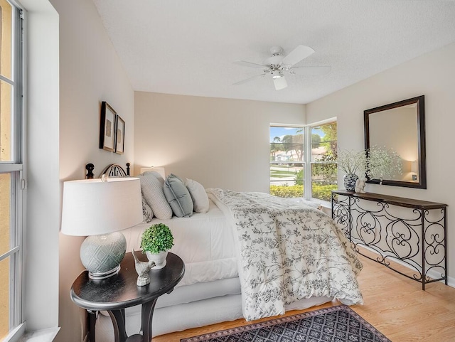 8520 Lake Cypress Rd, Lake Worth, FL 33467 - bedroom with wood finished floors and ceiling fan