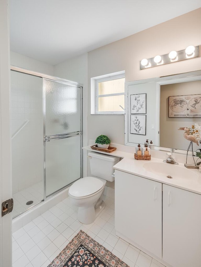 8520 Lake Cypress Rd, Lake Worth, FL 33467 - bathroom with toilet, vanity, a stall shower, and tile patterned floors