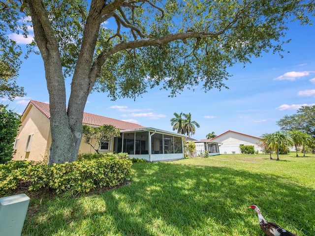 8520 Lake Cypress Rd, Lake Worth, FL 33467 - view of grassy yard with a sunroom
