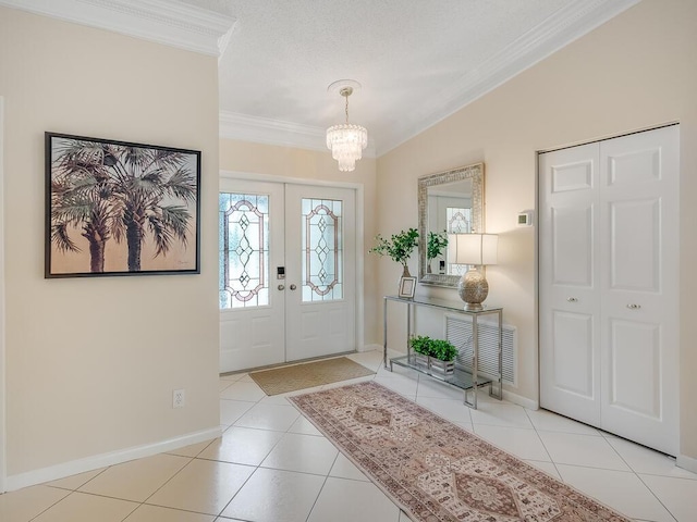 8520 Lake Cypress Rd, Lake Worth, FL 33467 - tiled foyer with ornamental molding, a chandelier, french doors, and baseboards