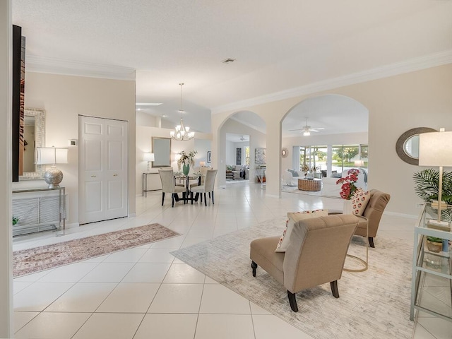 8520 Lake Cypress Rd, Lake Worth, FL 33467 - living area with arched walkways, ceiling fan, ornamental molding, a chandelier, and tile patterned flooring