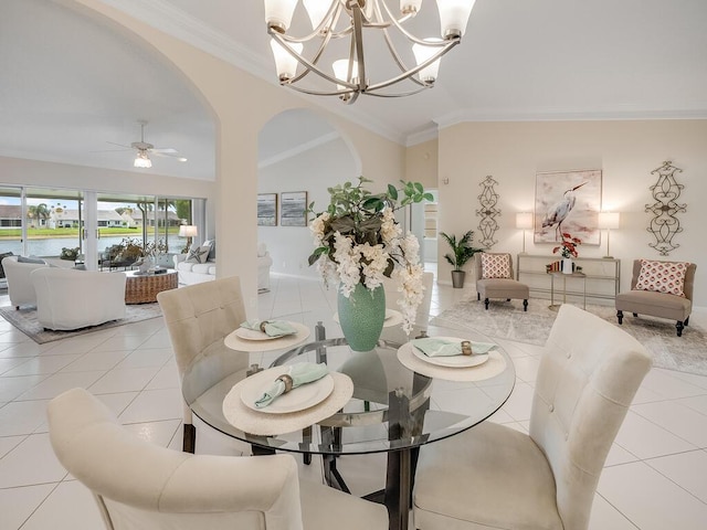 8520 Lake Cypress Rd, Lake Worth, FL 33467 - dining area with lofted ceiling, arched walkways, a chandelier, a ceiling fan, and light tile patterned floors
