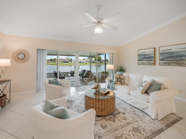 8520 Lake Cypress Rd, Lake Worth, FL 33467 - living area with vaulted ceiling, plenty of natural light, light tile patterned floors, ceiling fan, and ornamental molding