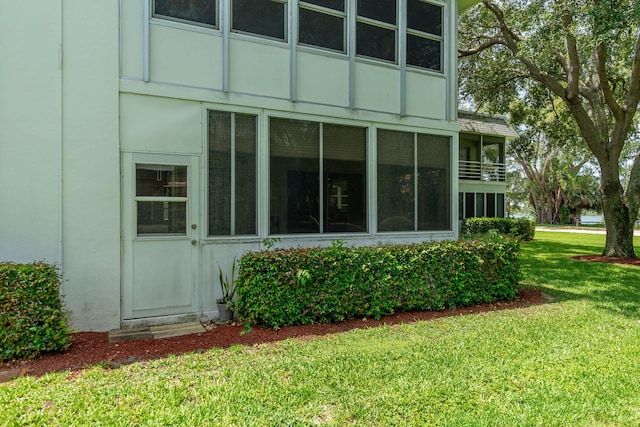 3000 Lake Osborne Dr Unit 103, Lake Worth Beach, FL 33461 - view of side of property with a yard and stucco siding