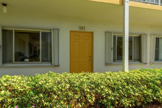 3000 Lake Osborne Dr Unit 103, Lake Worth Beach, FL 33461 - view of exterior entry with stucco siding