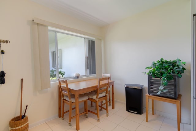3000 Lake Osborne Dr Unit 103, Lake Worth Beach, FL 33461 - dining area featuring baseboards