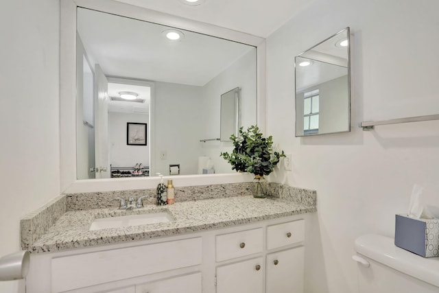 2751 N Palm Aire Dr Unit 304, Pompano Beach, FL 33069 - bathroom with toilet, vanity, and recessed lighting