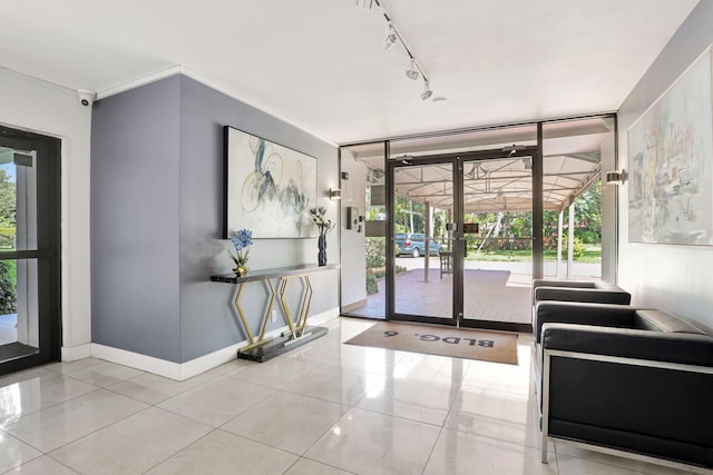 2751 N Palm Aire Dr Unit 304, Pompano Beach, FL 33069 - common area featuring a surveillance system and a wall of windows