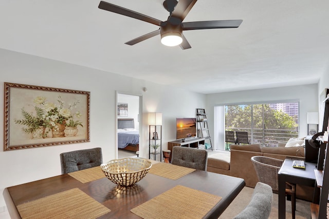 2751 N Palm Aire Dr Unit 304, Pompano Beach, FL 33069 - dining area with ceiling fan and wood finished floors