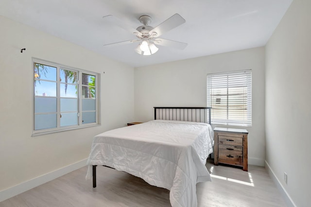 305 Vanderbilt Dr, Lake Worth Beach, FL 33460 - bedroom featuring multiple windows, wood finished floors, baseboards, and ceiling fan