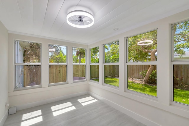305 Vanderbilt Dr, Lake Worth Beach, FL 33460 - unfurnished sunroom with healthy amount of natural light, baseboards, and wood finished floors