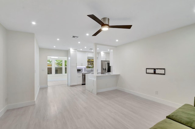 305 Vanderbilt Dr, Lake Worth Beach, FL 33460 - unfurnished living room with a ceiling fan, light wood-style floors, recessed lighting, and baseboards