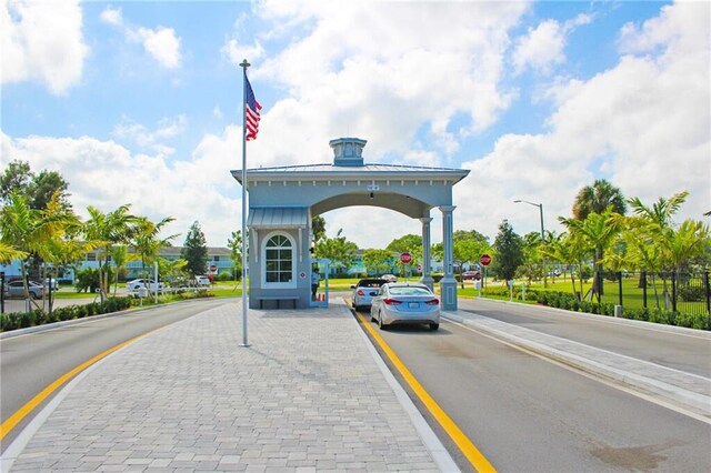 326 Markham O, Deerfield Beach, FL 33442 - view of asphalt road featuring traffic signs, street lighting, and curbs