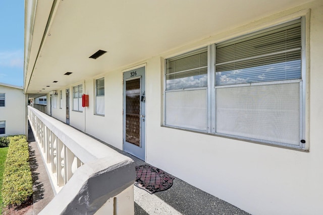 326 Markham O, Deerfield Beach, FL 33442 - view of exterior entry with a porch and stucco siding