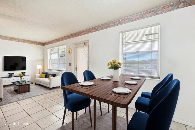 326 Markham O, Deerfield Beach, FL 33442 - dining room featuring a textured ceiling, light tile patterned floors, and baseboards