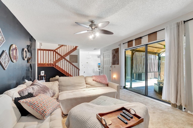 6644 66th Way, West Palm Beach, FL 33409 - living room featuring carpet floors, stairs, ceiling fan, and a textured ceiling