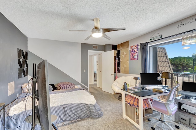6644 66th Way, West Palm Beach, FL 33409 - carpeted bedroom featuring a desk, a textured ceiling, and ceiling fan