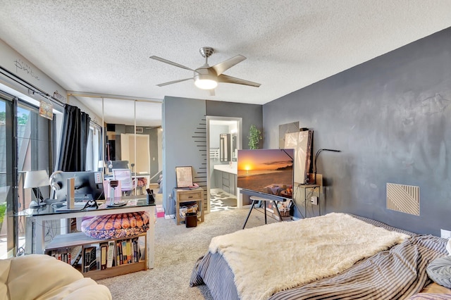 6644 66th Way, West Palm Beach, FL 33409 - carpeted bedroom featuring a textured ceiling and ceiling fan