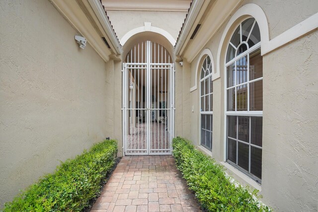 6468 Polo Pointe Way, Delray Beach, FL 33484 - entrance to property featuring stucco siding and a gate