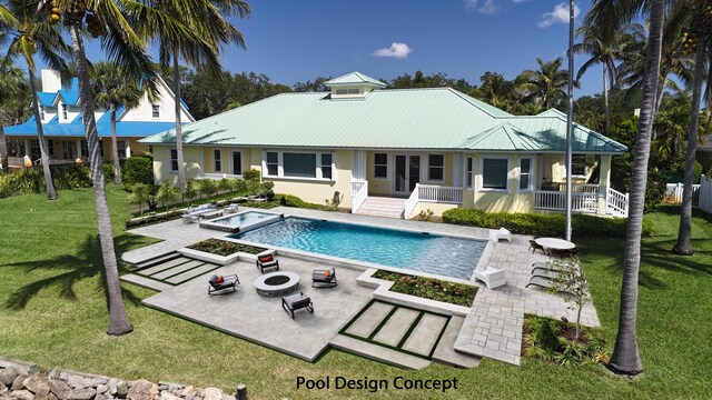 1530 NE Dixie Hwy, Jensen Beach, FL 34957 - rear view of house with stucco siding, an outdoor fire pit, a patio, and metal roof