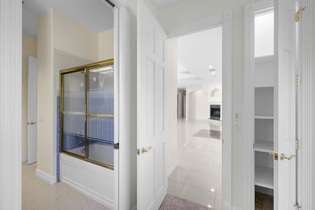 1530 NE Dixie Hwy, Jensen Beach, FL 34957 - bathroom featuring tile patterned flooring, enclosed tub / shower combo, and baseboards