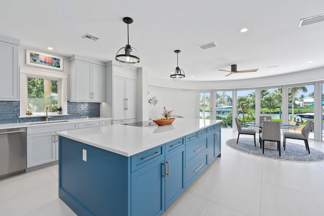 6460 SE Harbor Cir, Stuart, FL 34996 - kitchen featuring dishwasher, a sink, plenty of natural light, light countertops, and recessed lighting