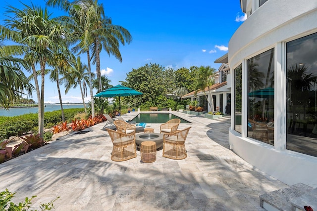 6460 SE Harbor Cir, Stuart, FL 34996 - view of patio featuring a water view and an outdoor pool