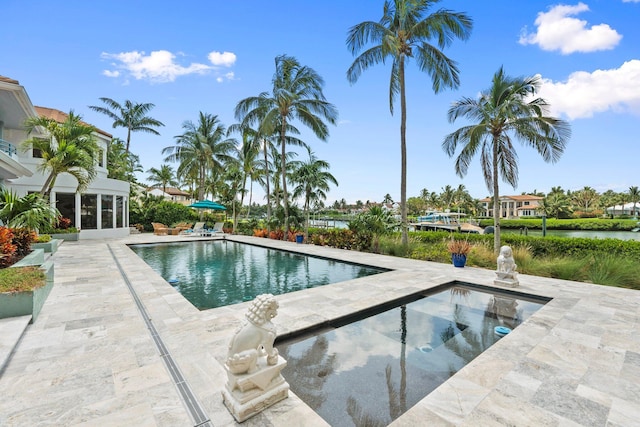 6460 SE Harbor Cir, Stuart, FL 34996 - outdoor pool with a patio and a jacuzzi
