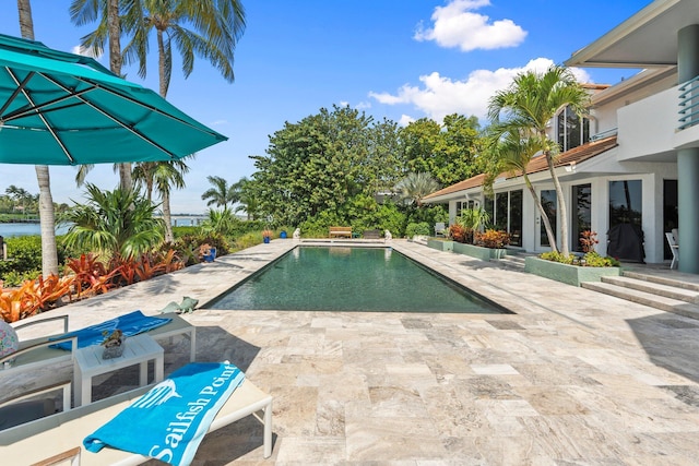 6460 SE Harbor Cir, Stuart, FL 34996 - outdoor pool featuring a patio area