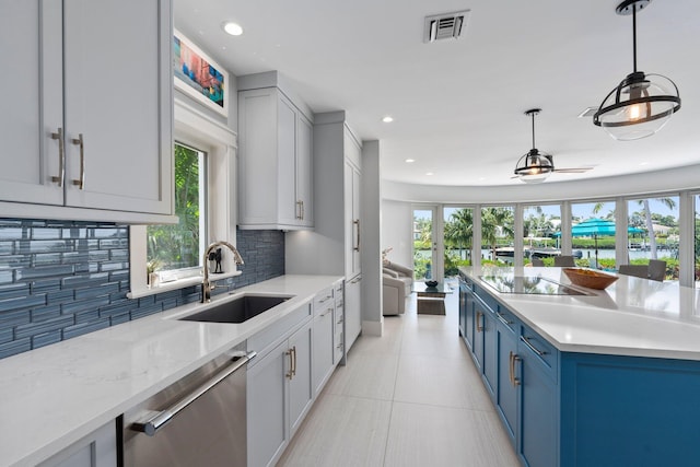 6460 SE Harbor Cir, Stuart, FL 34996 - kitchen with a sink, dishwasher, black electric stovetop, a water view, and tasteful backsplash
