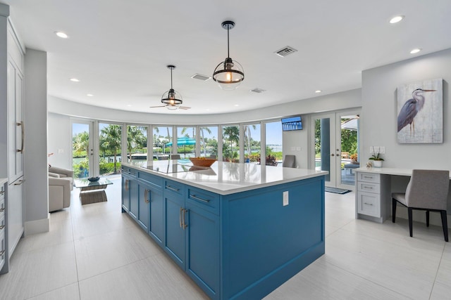 6460 SE Harbor Cir, Stuart, FL 34996 - kitchen featuring french doors, blue cabinets, black electric cooktop, light countertops, and recessed lighting