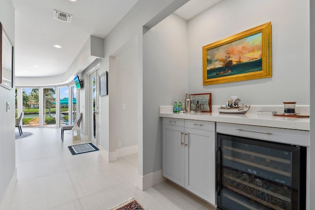 6460 SE Harbor Cir, Stuart, FL 34996 - bar area with beverage cooler, baseboards, recessed lighting, and light tile patterned flooring