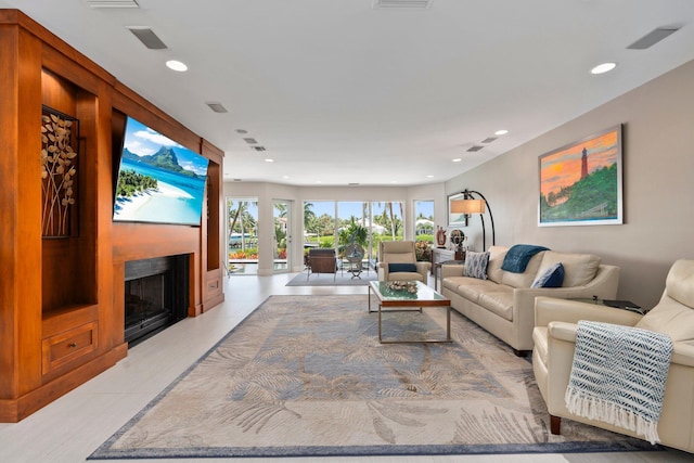 6460 SE Harbor Cir, Stuart, FL 34996 - living room featuring a fireplace and recessed lighting
