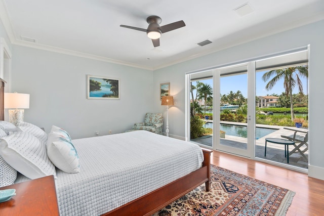 6460 SE Harbor Cir, Stuart, FL 34996 - bedroom with access to exterior, wood finished floors, crown molding, a ceiling fan, and a water view