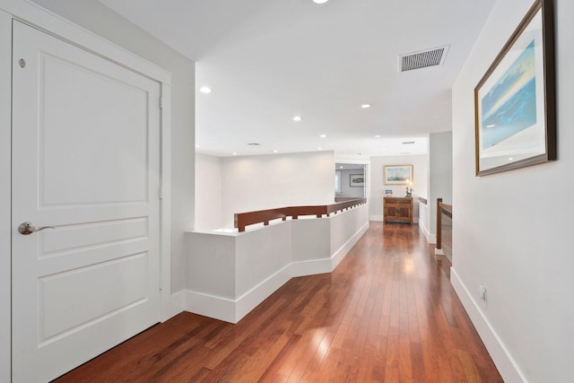 6460 SE Harbor Cir, Stuart, FL 34996 - hallway with hardwood / wood-style floors, baseboards, and recessed lighting