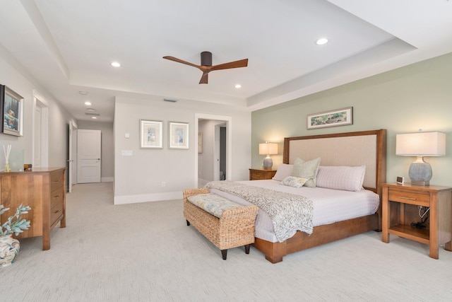 6460 SE Harbor Cir, Stuart, FL 34996 - bedroom with a raised ceiling, recessed lighting, light carpet, baseboards, and ceiling fan