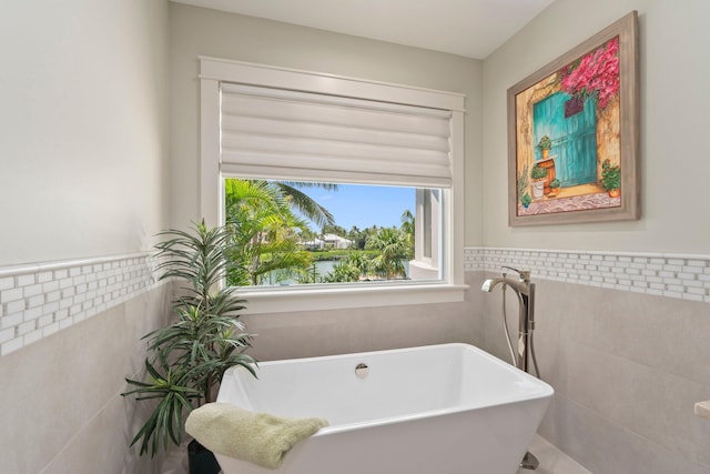 6460 SE Harbor Cir, Stuart, FL 34996 - full bath with tile walls and a freestanding tub