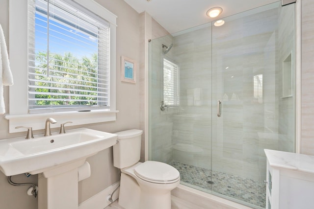 6460 SE Harbor Cir, Stuart, FL 34996 - full bath featuring toilet, a stall shower, a sink, and baseboards