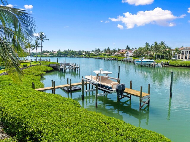 6460 SE Harbor Cir, Stuart, FL 34996 - dock area with a water view and boat lift